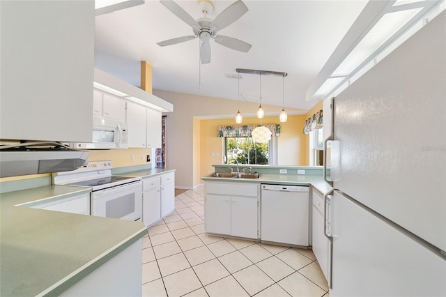 kitchen featuring pendant lighting, white cabinets, vaulted ceiling, white appliances, and ceiling fan