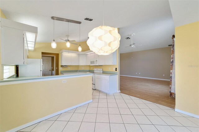 kitchen with white cabinets, light hardwood / wood-style flooring, white appliances, decorative light fixtures, and ceiling fan