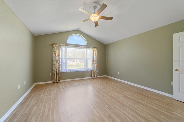 spare room featuring lofted ceiling, ceiling fan, and light hardwood / wood-style floors