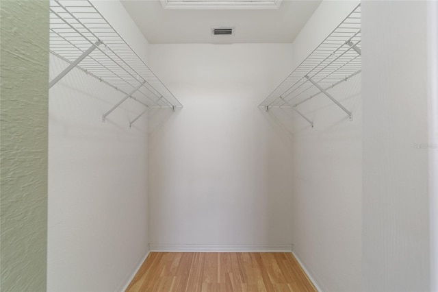 spacious closet featuring wood-type flooring