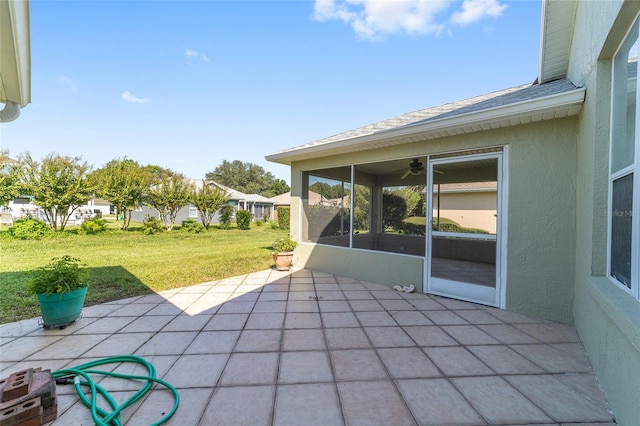 view of patio with a sunroom