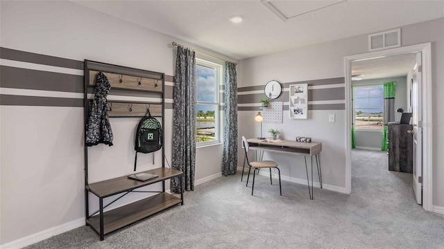 office featuring light colored carpet and a textured ceiling