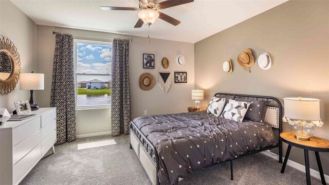 carpeted bedroom with ceiling fan