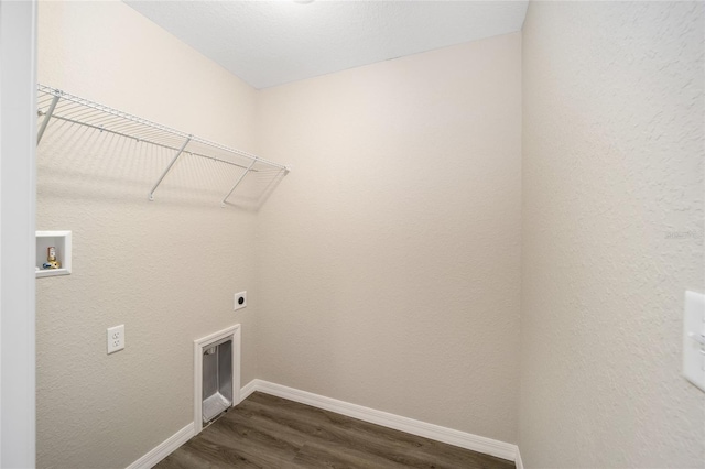 clothes washing area with washer hookup, hookup for an electric dryer, and dark hardwood / wood-style flooring