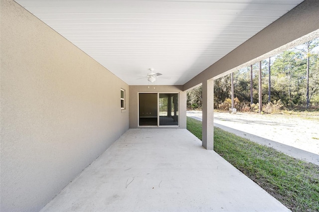 view of patio featuring ceiling fan