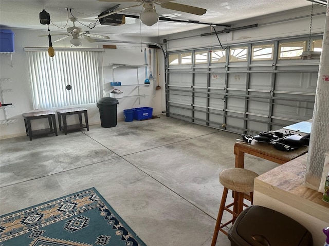 garage featuring a garage door opener and ceiling fan