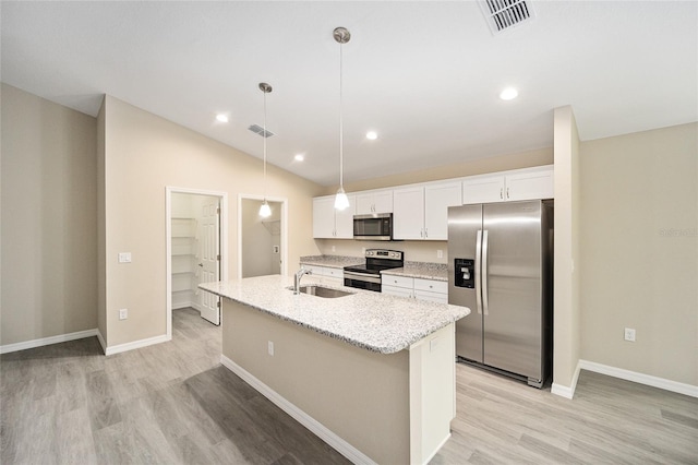 kitchen featuring appliances with stainless steel finishes, hanging light fixtures, a kitchen island with sink, light hardwood / wood-style flooring, and white cabinets