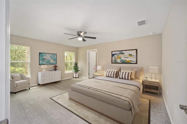 carpeted bedroom with ceiling fan