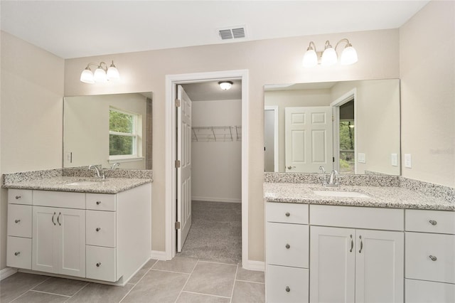 bathroom with vanity and tile patterned floors