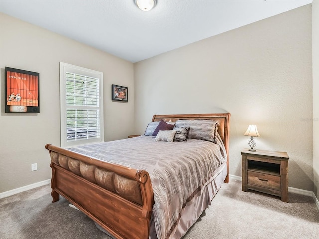 bedroom with light carpet