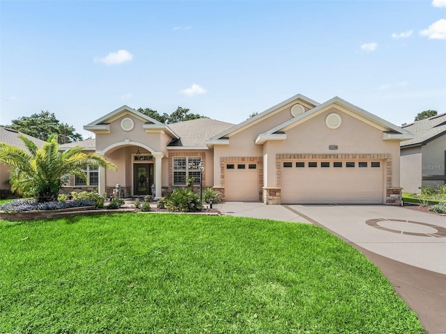 view of front of property with a garage and a front lawn