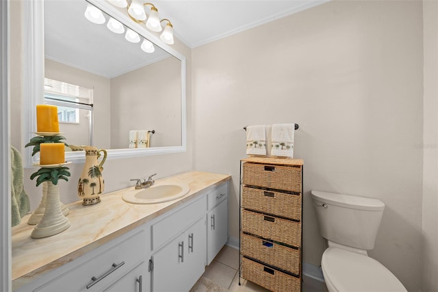 bathroom featuring tile patterned floors, vanity, toilet, and ornamental molding