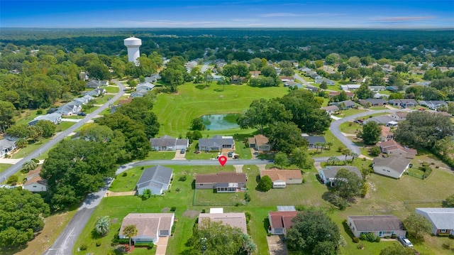 drone / aerial view with a water view and a residential view