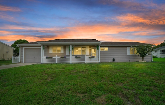 ranch-style home with a front lawn, a porch, fence, concrete driveway, and an attached garage