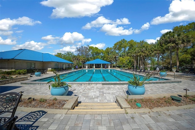 10820 SW 87th Ter, Ocala, FL 34481 - community pool with a patio