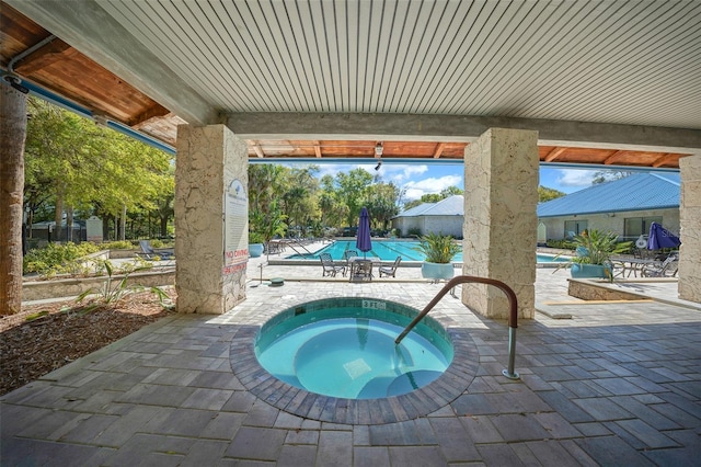 10820 SW 87th Ter, Ocala, FL 34481 - community pool with a community hot tub and a patio area