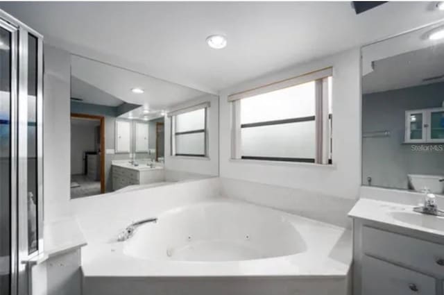 15735 SW 52nd Avenue Rd, Ocala, FL 34473 - full bath with a tub with jets and vanity