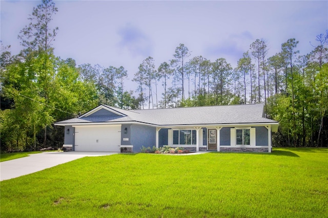 ranch-style home with a garage and a front lawn