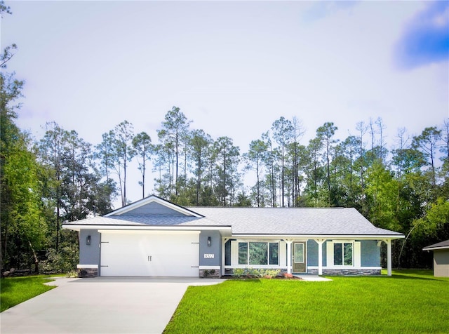 single story home featuring a front lawn and a garage