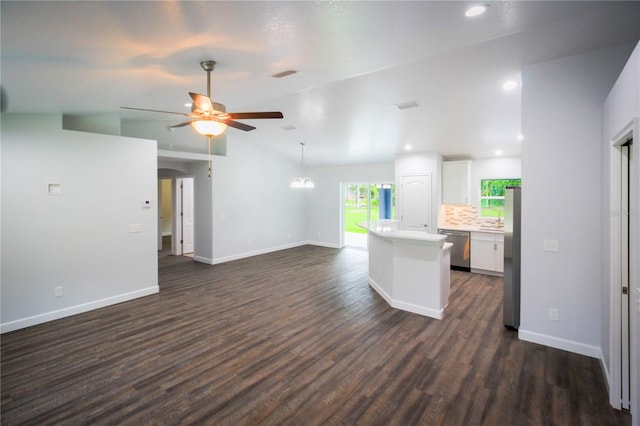 unfurnished living room featuring ceiling fan, lofted ceiling, and dark wood-type flooring