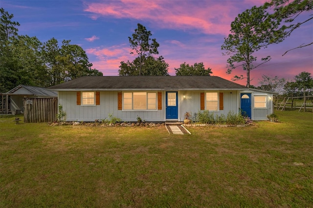 view of front of property with a lawn