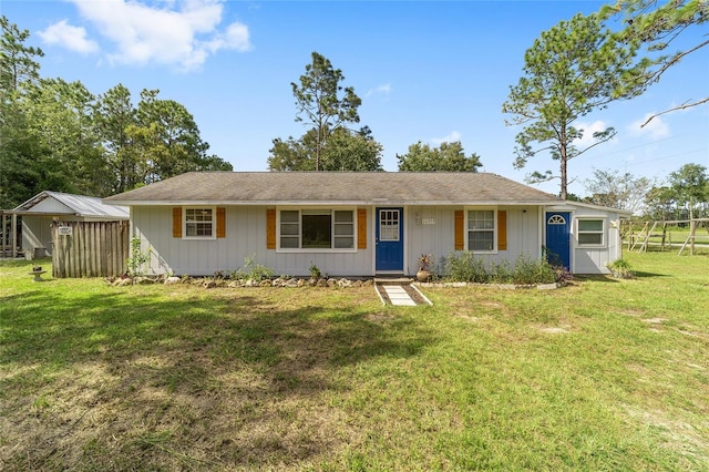 ranch-style home featuring a front lawn