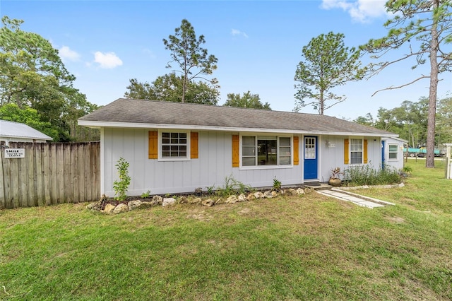 ranch-style home with a front yard