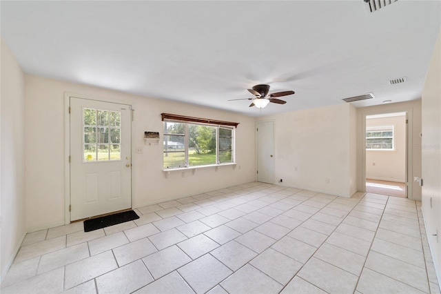 entrance foyer featuring ceiling fan and light tile patterned flooring