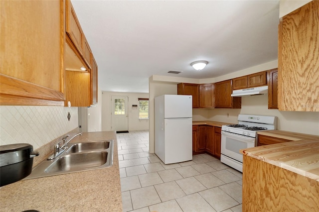 kitchen with sink and white appliances