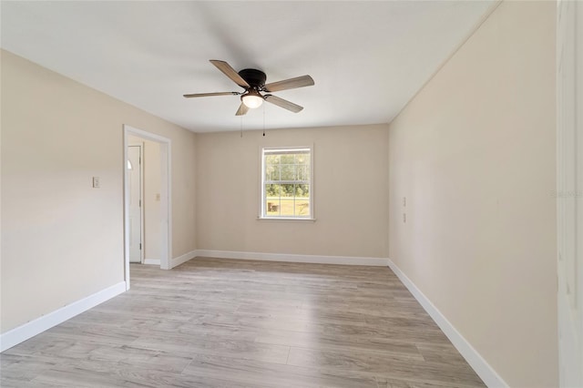 spare room featuring ceiling fan and light hardwood / wood-style floors