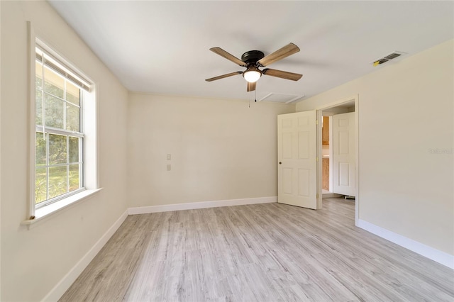 unfurnished room with light wood-type flooring and ceiling fan