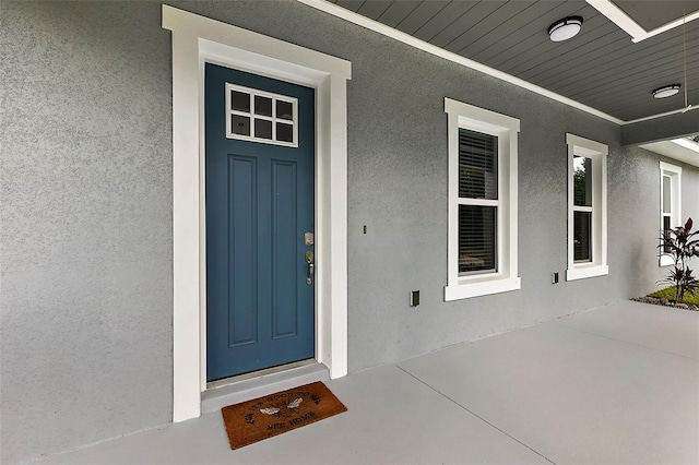 doorway to property featuring covered porch