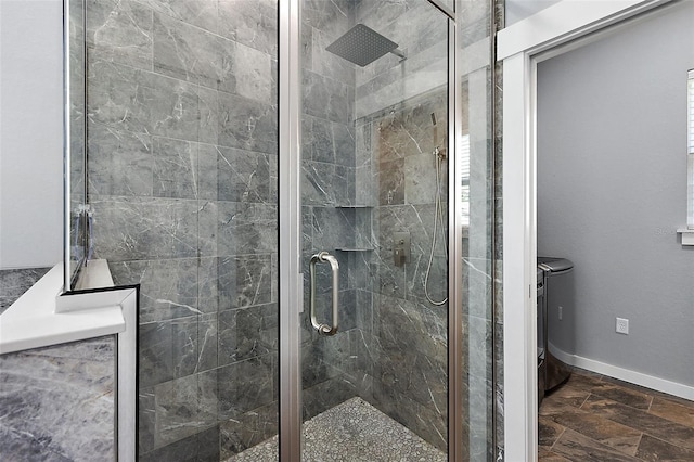 bathroom featuring a shower with shower door