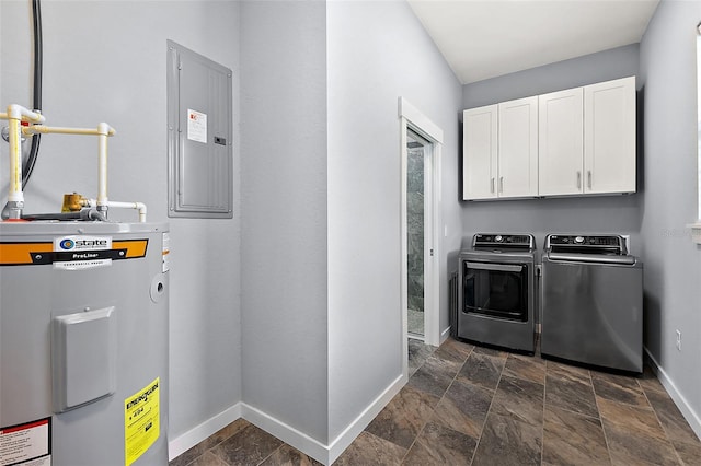 washroom with electric panel, water heater, cabinets, and washer and clothes dryer