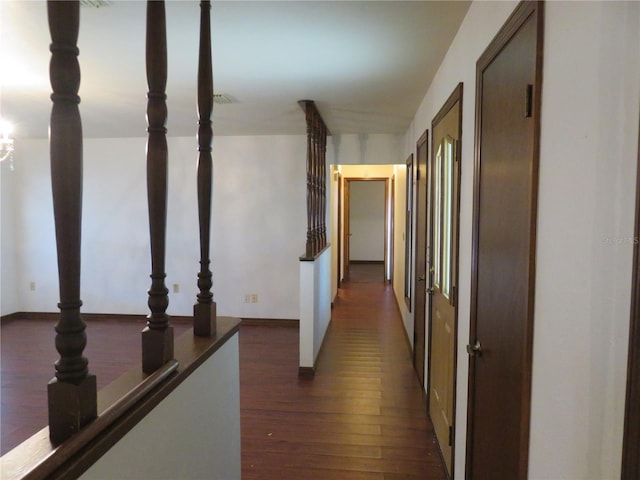 hallway with dark hardwood / wood-style floors