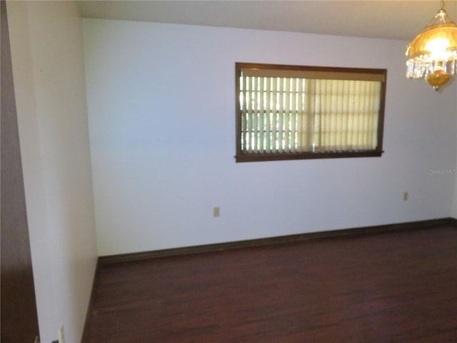 spare room featuring dark hardwood / wood-style floors