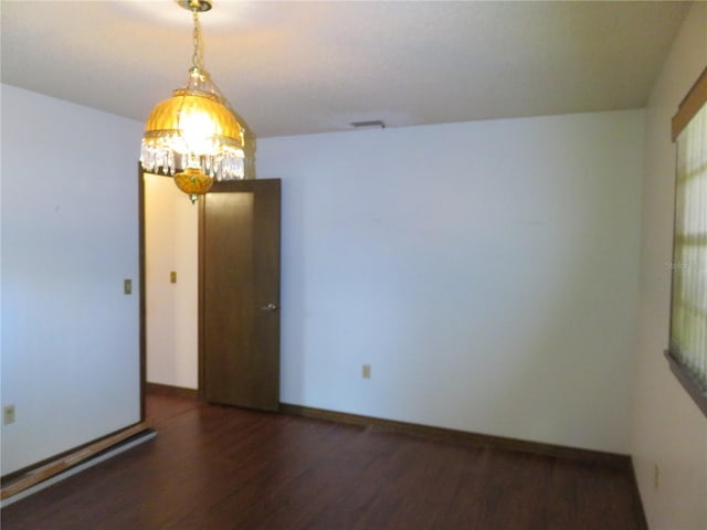 spare room featuring dark hardwood / wood-style floors