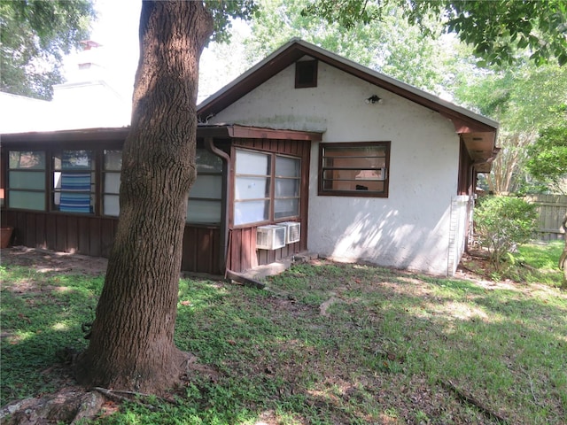 back of house featuring a yard