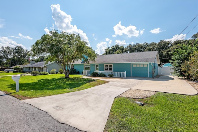 ranch-style house with a garage and a front yard