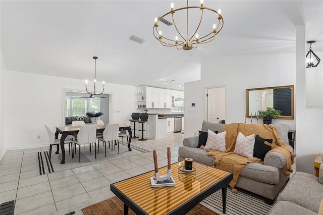 tiled living room featuring a chandelier and vaulted ceiling