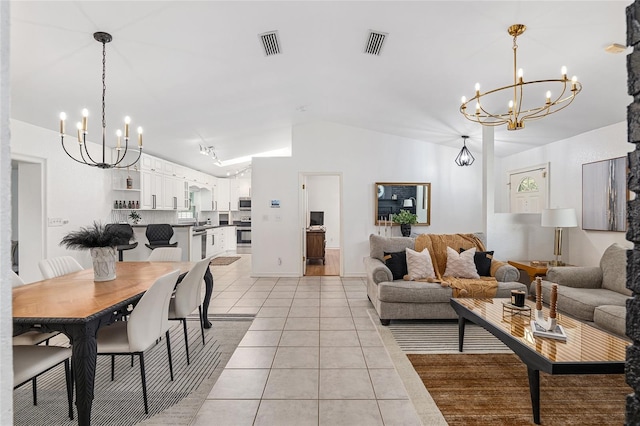 living room featuring vaulted ceiling and light tile patterned floors