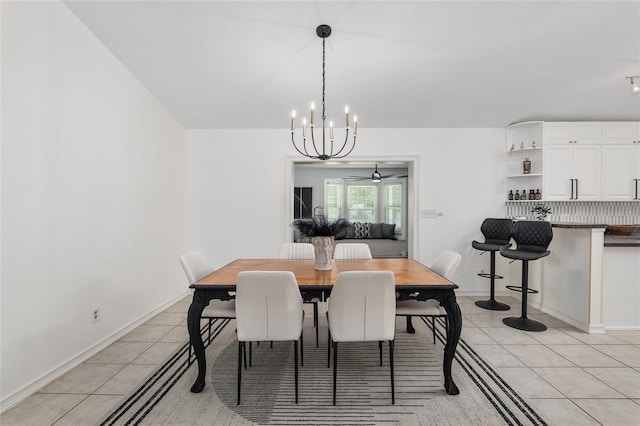 6212 NE 26th Ave, Ocala, FL 34479 - dining room with light tile patterned flooring, a chandelier, and baseboards