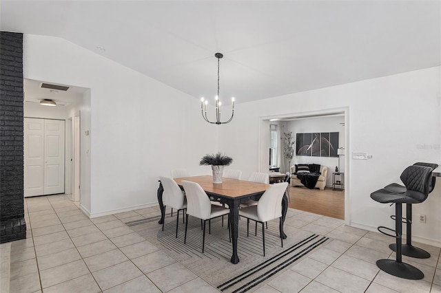 6212 NE 26th Ave, Ocala, FL 34479 - dining room with a chandelier, light tile patterned floors, lofted ceiling, and baseboards