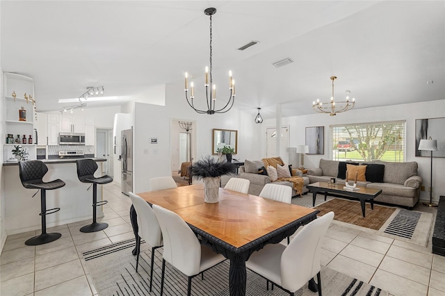 tiled dining room featuring a notable chandelier