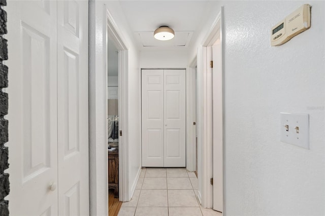 corridor with light tile patterned floors