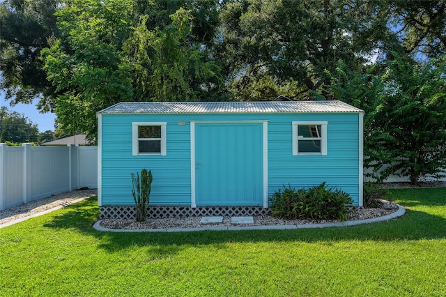 view of outdoor structure with a yard