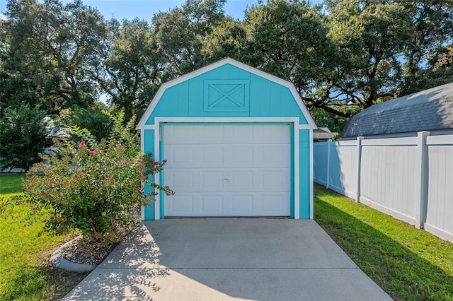 garage featuring a lawn