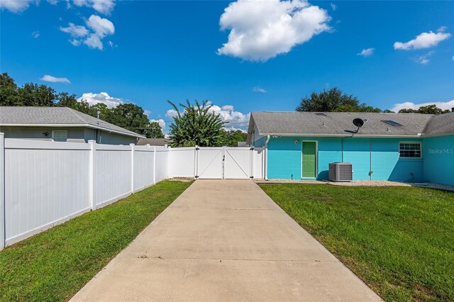 6212 NE 26th Ave, Ocala, FL 34479 - view of yard with a gate and central AC unit