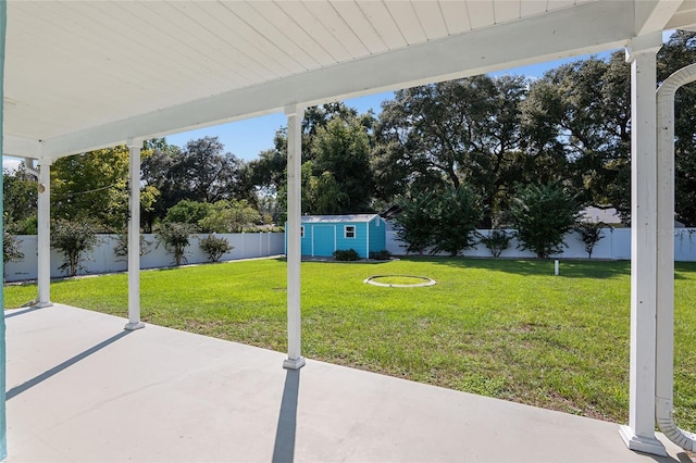 exterior space with a shed and a patio