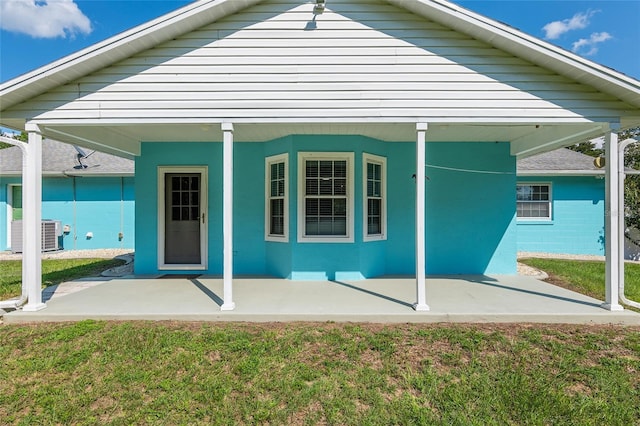 6212 NE 26th Ave, Ocala, FL 34479 - rear view of property featuring a patio area, a yard, and central air condition unit